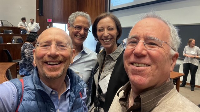 Richard Baldwin (Graduate Institute of Geneva), Dan Trefler (University of Toronto), and Paola Conconi (Oxford) take a picture with Grossman at the conference.