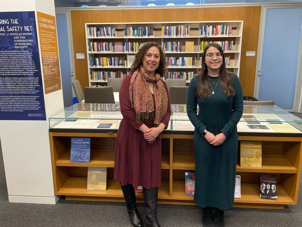 Charissa Jefferson and Adrianna Taraboletti are seen in the Industrial Relations Library during an exhibit on IR Section Founding Director J. Douglas Brown. 