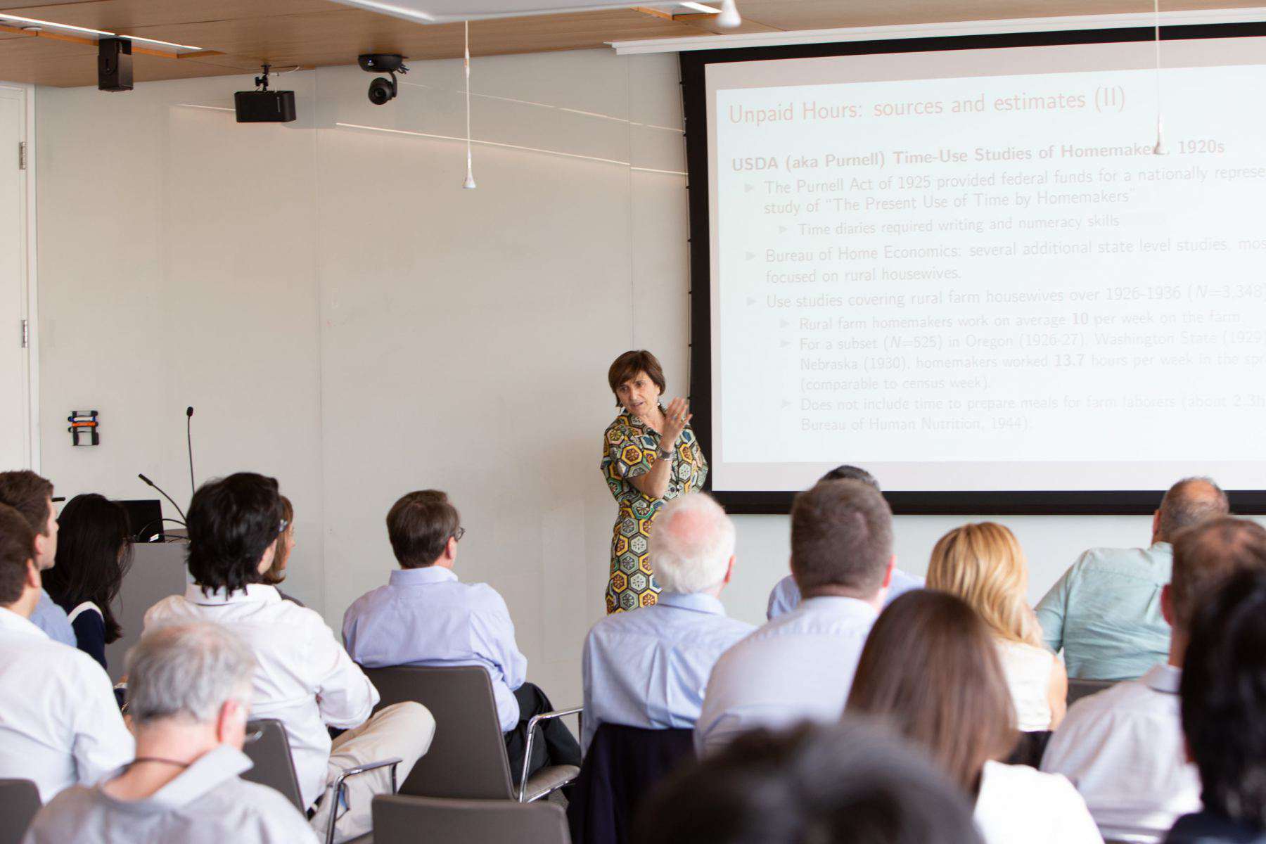 Claudia Olivetti (Dartmouth College) presents during a research seminar.